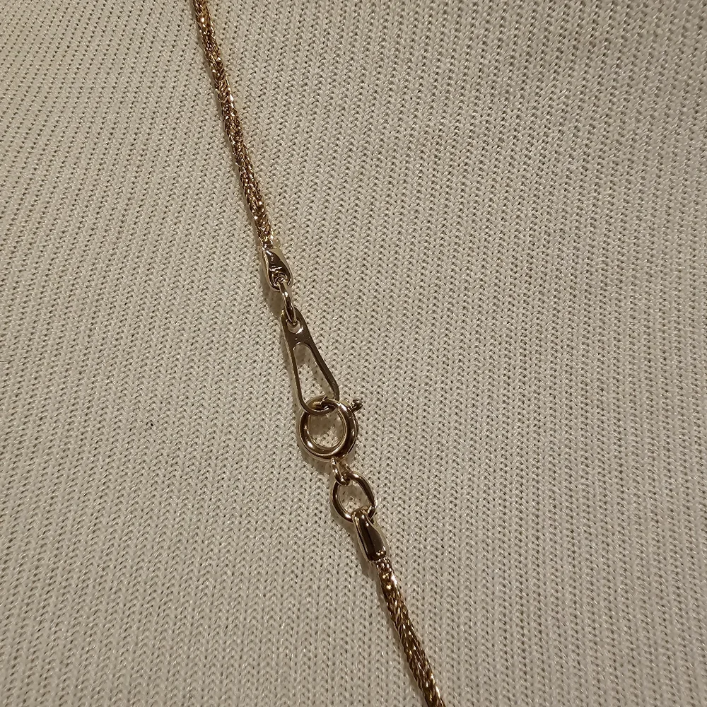 Goldtone filigree elephant pendant on a twisted goldtone chain - Picture 3 of 3